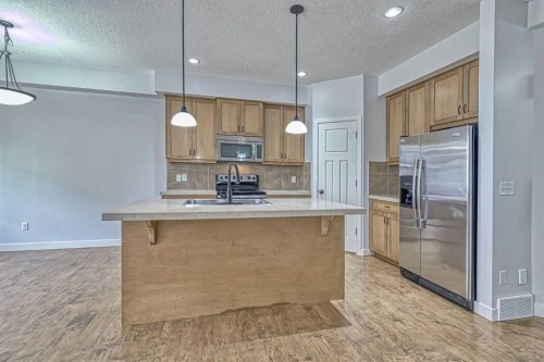 508-413 River Avenue, Cochrane, AB - Indoor Photo Showing Kitchen