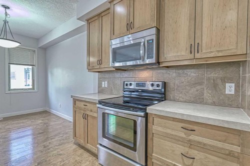 508-413 River Avenue, Cochrane, AB - Indoor Photo Showing Kitchen
