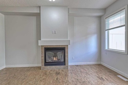 508-413 River Avenue, Cochrane, AB - Indoor Photo Showing Living Room With Fireplace