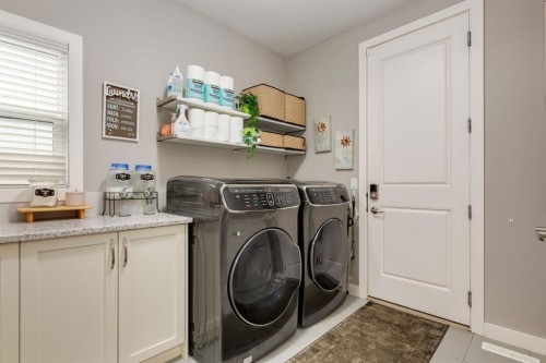 39 Cranbrook Crescent Se, Calgary, AB - Indoor Photo Showing Laundry Room