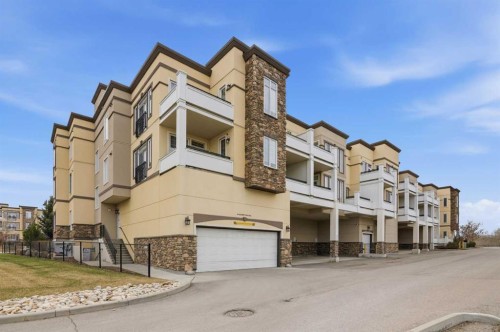 207-39 Quarry Gate Se, Calgary, AB - Outdoor With Balcony With Facade