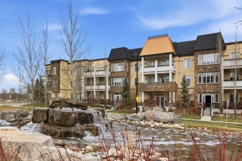 207-39 Quarry Gate Se, Calgary, AB - Outdoor With Balcony With Facade