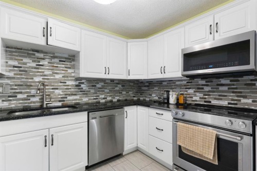 8 Hawkfield Crescent Nw, Calgary, AB - Indoor Photo Showing Kitchen With Double Sink With Upgraded Kitchen