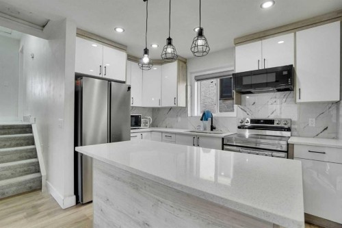 51 Taraglen Road Ne, Calgary, AB - Indoor Photo Showing Kitchen With Upgraded Kitchen