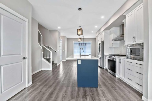 80 Wolf Gate, Okotoks, AB - Indoor Photo Showing Kitchen With Upgraded Kitchen