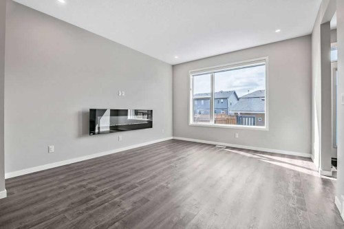 80 Wolf Gate, Okotoks, AB - Indoor Photo Showing Living Room With Fireplace