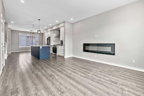 80 Wolf Gate, Okotoks, AB - Indoor Photo Showing Living Room With Fireplace