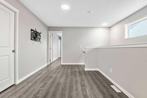 80 Wolf Gate, Okotoks, AB - Indoor Photo Showing Other Room