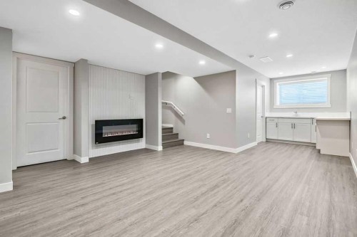 80 Wolf Gate, Okotoks, AB - Indoor With Fireplace
