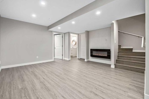 80 Wolf Gate, Okotoks, AB - Indoor Photo Showing Other Room With Fireplace