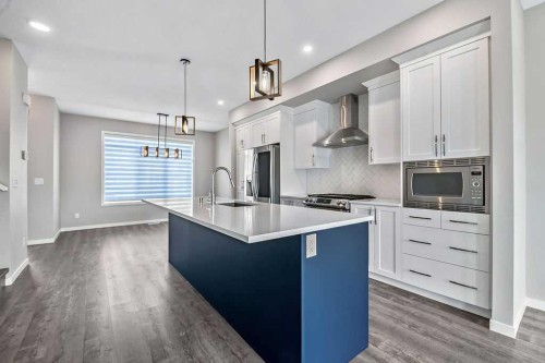 80 Wolf Gate, Okotoks, AB - Indoor Photo Showing Kitchen With Upgraded Kitchen