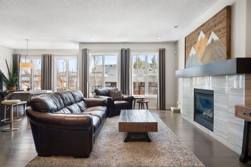 5 Riviera Crescent, Cochrane, AB - Indoor Photo Showing Living Room With Fireplace