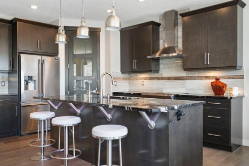 5 Riviera Crescent, Cochrane, AB - Indoor Photo Showing Kitchen With Stainless Steel Kitchen With Upgraded Kitchen