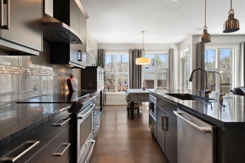5 Riviera Crescent, Cochrane, AB - Indoor Photo Showing Kitchen With Stainless Steel Kitchen With Upgraded Kitchen