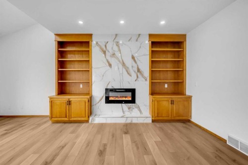 208 Coral Shores Bay Ne, Calgary, AB - Indoor With Fireplace