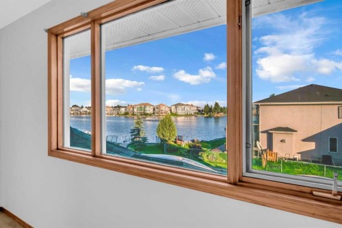 208 Coral Shores Bay Ne, Calgary, AB - Indoor Photo Showing Other Room With Body Of Water