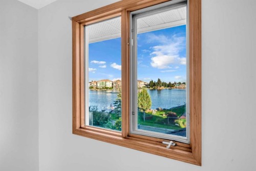 208 Coral Shores Bay Ne, Calgary, AB - Indoor Photo Showing Other Room With Body Of Water