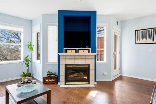 207-60 Promenade Way Se, Calgary, AB - Indoor Photo Showing Living Room With Fireplace