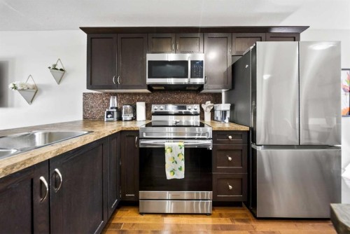 212 Cascades Pass, Chestermere, AB - Indoor Photo Showing Kitchen With Stainless Steel Kitchen