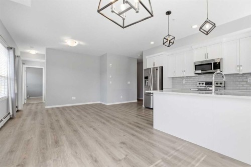 204-4150 Seton Drive Se, Calgary, AB - Indoor Photo Showing Kitchen With Upgraded Kitchen