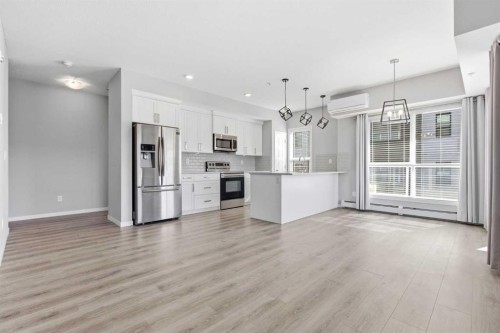 204-4150 Seton Drive Se, Calgary, AB - Indoor Photo Showing Kitchen With Stainless Steel Kitchen With Upgraded Kitchen