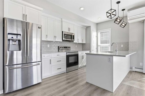 204-4150 Seton Drive Se, Calgary, AB - Indoor Photo Showing Kitchen With Stainless Steel Kitchen With Upgraded Kitchen