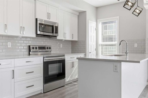 204-4150 Seton Drive Se, Calgary, AB - Indoor Photo Showing Kitchen With Upgraded Kitchen