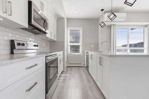 204-4150 Seton Drive Se, Calgary, AB - Indoor Photo Showing Kitchen With Upgraded Kitchen