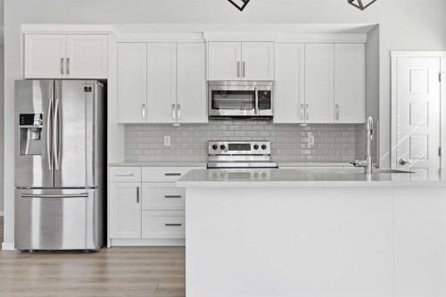 204-4150 Seton Drive Se, Calgary, AB - Indoor Photo Showing Kitchen With Stainless Steel Kitchen With Upgraded Kitchen