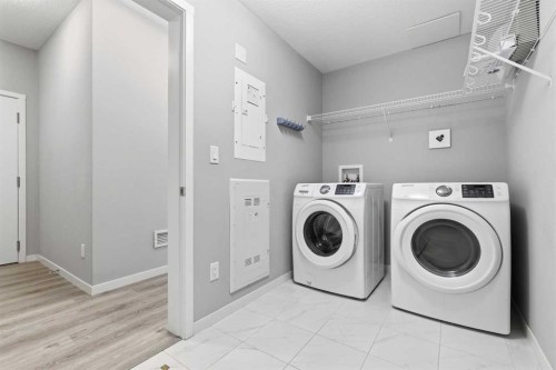 204-4150 Seton Drive Se, Calgary, AB - Indoor Photo Showing Laundry Room