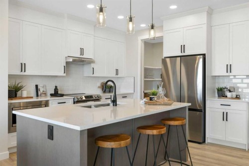 450 Kinniburgh Loop, Chestermere, AB - Indoor Photo Showing Kitchen With Double Sink With Upgraded Kitchen