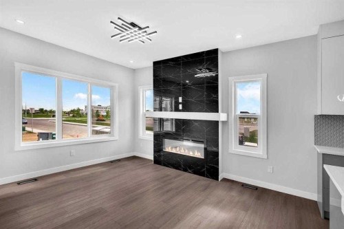 110 Saddlepeace Crescent Ne, Calgary, AB - Indoor Photo Showing Living Room With Fireplace
