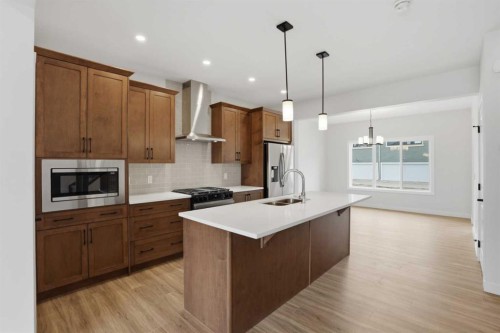 80 Buffaloberry Manor Se, Calgary, AB - Indoor Photo Showing Kitchen With Double Sink With Upgraded Kitchen