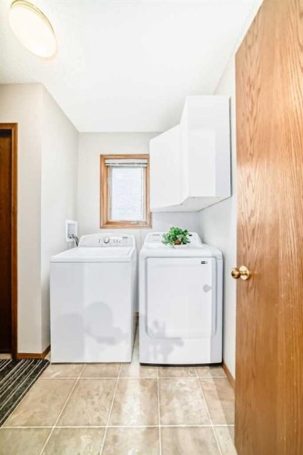 219 Hawkstone Close Nw, Calgary, AB - Indoor Photo Showing Laundry Room
