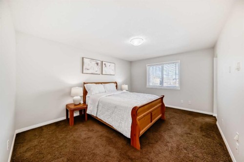 795 New Brighton Drive Se, Calgary, AB - Indoor Photo Showing Bedroom