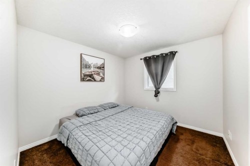 795 New Brighton Drive Se, Calgary, AB - Indoor Photo Showing Bedroom