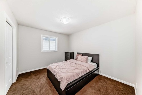795 New Brighton Drive Se, Calgary, AB - Indoor Photo Showing Bedroom