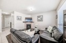 795 New Brighton Drive Se, Calgary, AB  - Indoor Photo Showing Living Room With Fireplace 