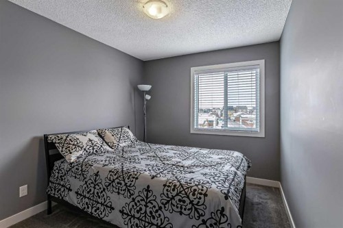 23 Marquis Link Se, Calgary, AB - Indoor Photo Showing Bedroom