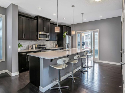 23 Marquis Link Se, Calgary, AB - Indoor Photo Showing Kitchen With Stainless Steel Kitchen With Upgraded Kitchen