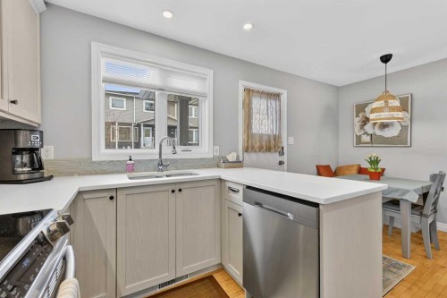 563 Regal Park Ne, Calgary, AB - Indoor Photo Showing Kitchen With Double Sink