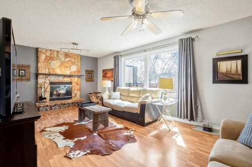 13 Maplewood Estates, Strathmore, AB - Indoor Photo Showing Living Room With Fireplace