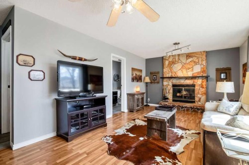 13 Maplewood Estates, Strathmore, AB - Indoor Photo Showing Living Room With Fireplace