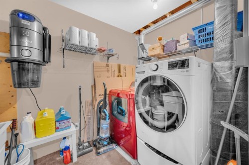 207 Elgin Meadows Gardens Se, Calgary, AB - Indoor Photo Showing Laundry Room