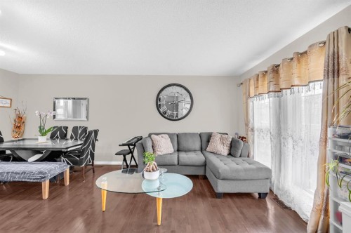 207 Elgin Meadows Gardens Se, Calgary, AB - Indoor Photo Showing Living Room