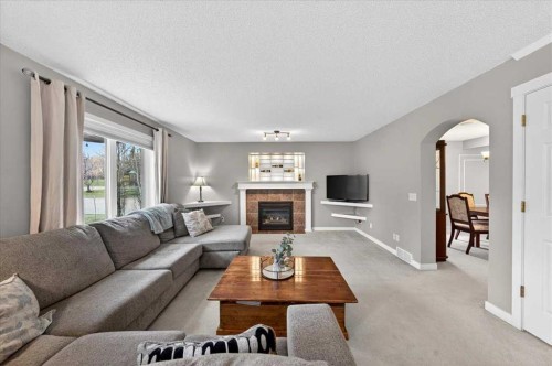 127 Hidden Ranch Terrace Nw, Calgary, AB - Indoor Photo Showing Living Room With Fireplace