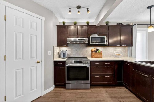 127 Hidden Ranch Terrace Nw, Calgary, AB - Indoor Photo Showing Kitchen With Upgraded Kitchen