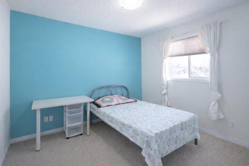 125 Silverado Range Cove Sw, Calgary, AB - Indoor Photo Showing Bedroom