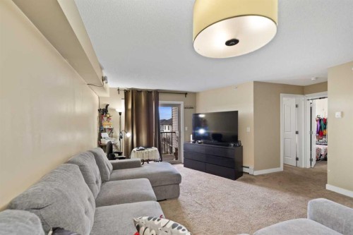 404-355 Taralake Way Ne, Calgary, AB - Indoor Photo Showing Living Room