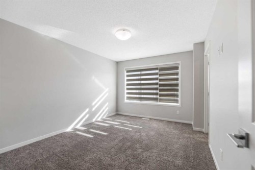 281 Creekside Boulevard Sw, Calgary, AB - Indoor Photo Showing Other Room
